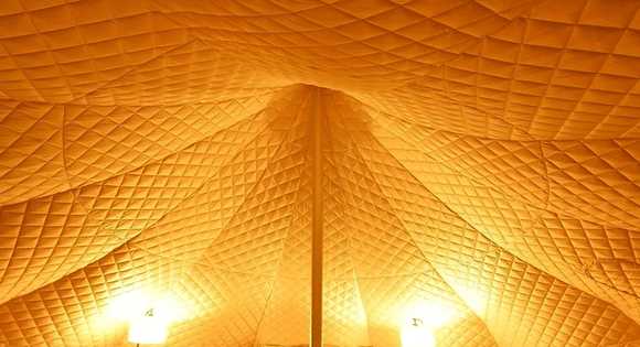 Tent Liners & Insulation - image of quilted tent liner installed in a bell tent. Essential bit of kit for adding extra warmth and insulation on your camping & glamping trips. Lotus Belle